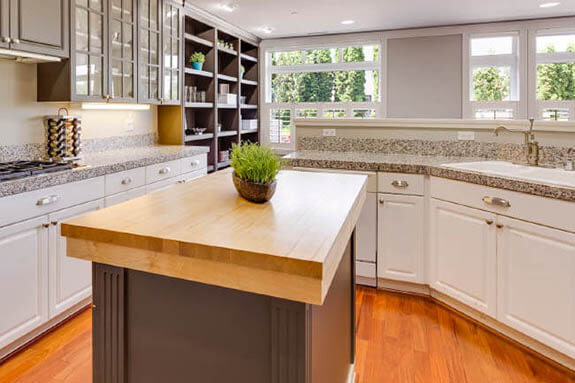 granite kitchen counter with butcher block island