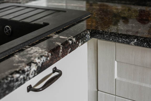 black granite with white cabinet